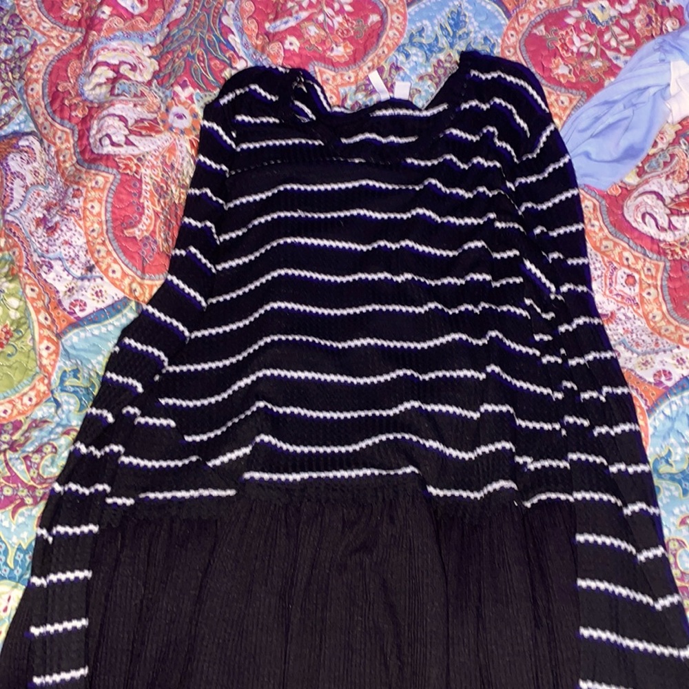 A large long sleeve black and white blouse